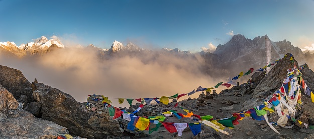 A panoramic shot of colorful Tibetan prayer flags on a mountain. Great for depicting Tibetan culture.