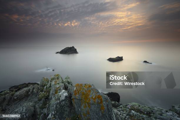 Calm Day At The Ocean With The Sky Shining Lightly In Pentire Point East Cornwall Uk Stock Photo - Download Image Now