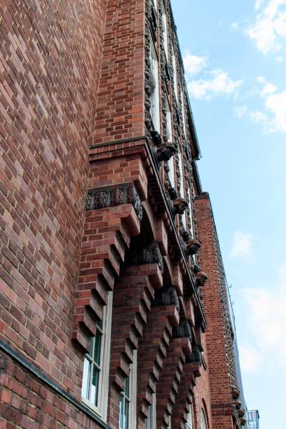 istock Vertical low angle shot of a red building under the beautiful cloudy sky 1440289098