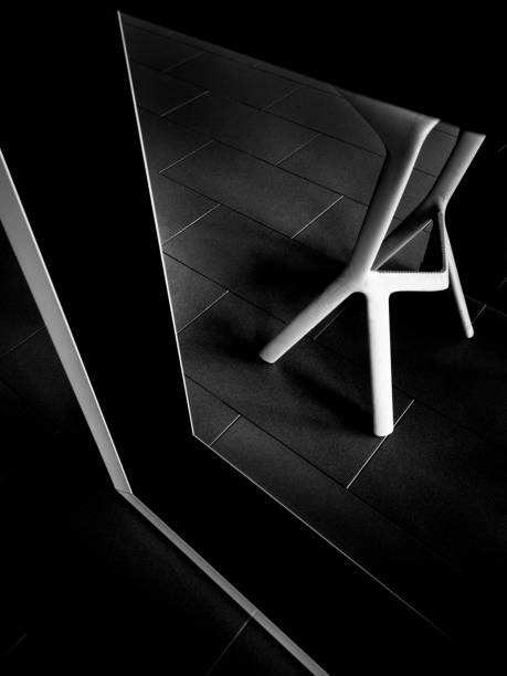 istock Vertical greyscale shot of a table with a black frame in a cafe during daytime 1440289468