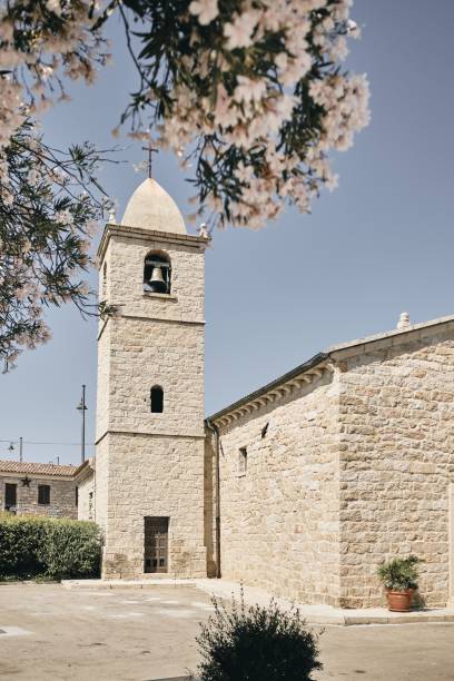 Vertical shot of the san Pantaleo olbia with a blue sky in the background at daytime A vertical shot of the san Pantaleo olbia with a blue sky in the background at daytime Cala Di Volpe stock pictures, royalty-free photos & images