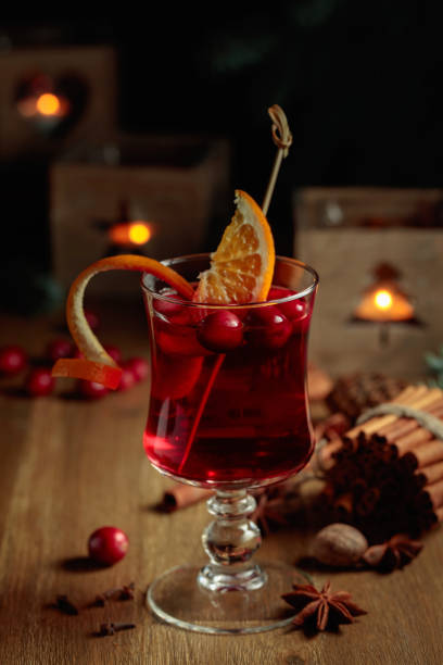 istock Christmas drink with spices, orange, and cranberries. 1440289955