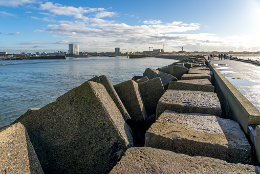 Large concrete blocks in perspective to protect the harbor of Scheveningen from storm waves