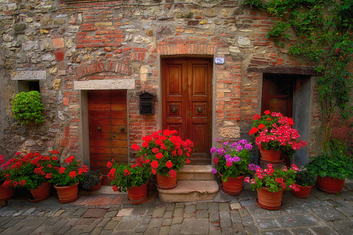 Florence, Italy – July 06, 2014: Beautiful cobblestone entrance to a happy home in Florence Italy