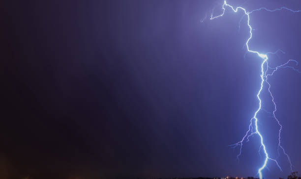 istock Mighty lightning strike in the purple shaded sky 1440290560