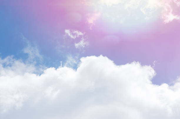 istock Beautiful shot of the blue sky, white clouds and falling sun rays 1440291679