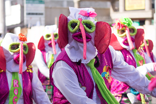 Barranquilla, Colombia – February 13, 2018: A group of characters from Monocuco pass through the cheerful troupe of the Battle of Flowers of the Barranquilla Carnival