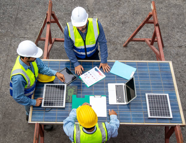 istock Foreman teamwork discussing with solar photovoltaic panels at the workplace 1440293000