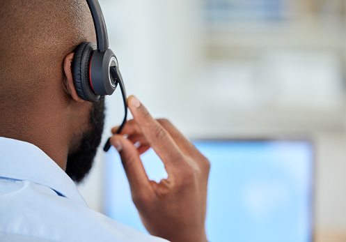 Telemarketing, support consultant or call center agent with headset closeup and online computer. Consulting customer service or IT technology or crm black man talking, advice or help for contact us