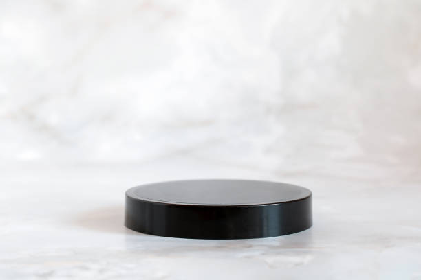 istock black podium, pedestal for mounting your product. background, mockup, scene creator, copy space. 1440296827