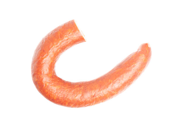 istock Krakow sausage top view isolated on white background 1440296897