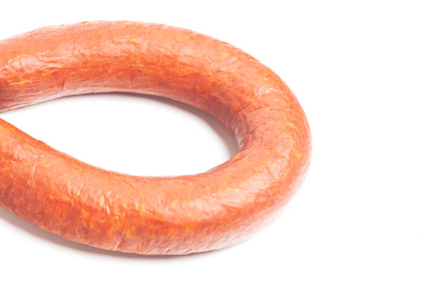 istock Krakow sausage top view isolated on white background 1440297191