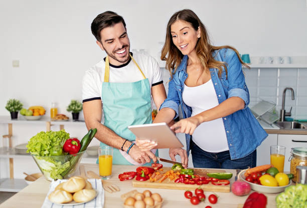 istock Happy couple is cooking in a kitchen 1440301404