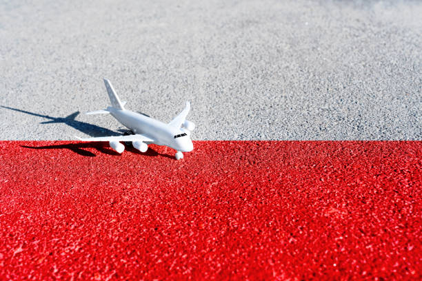 Toy airplane placed on the road painted the colors of the national flag of Poland.