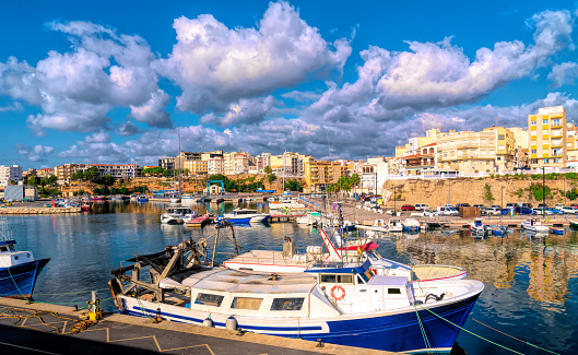 L'Ametlla de Mar Spain harbour and boats in port enjoying in sunshine in the coast town Tarragona province Catalonia Mediterranean port