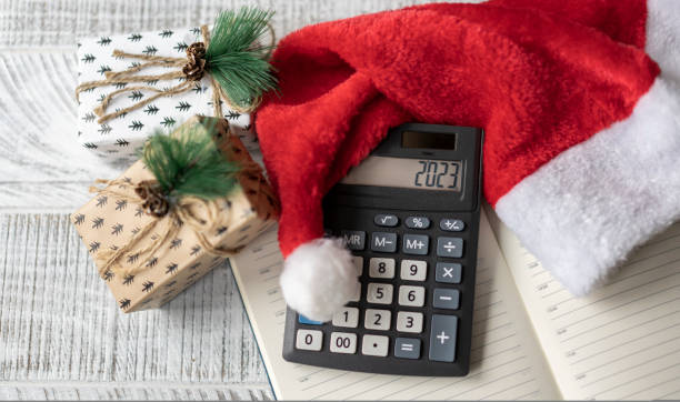 istock New Year's layout with calculator, Santa's hat and Christmas decorations 1440308710