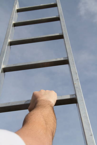 istock A man is trying to get up the ladder 1440311688