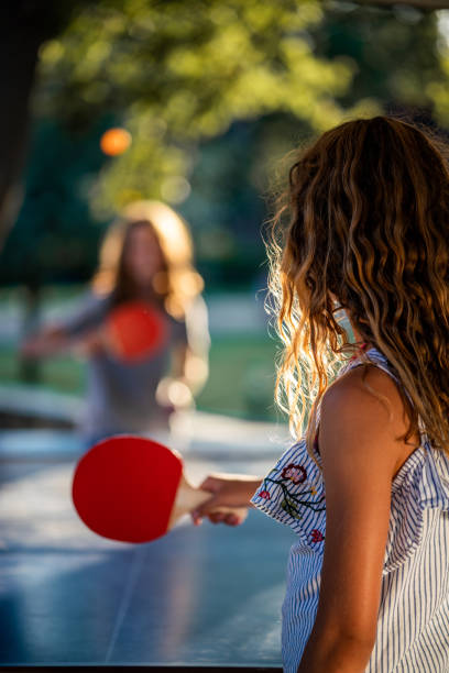 istock Girls playing table tennis on summer day 1440315070