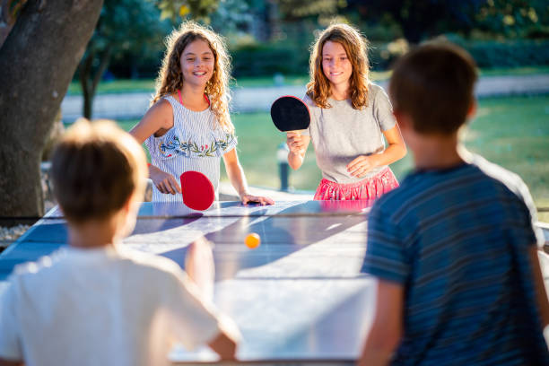 istock Children playing table tennis on summer day 1440315191