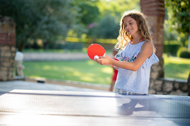 istock Girl playing table tennis on summer day 1440316427