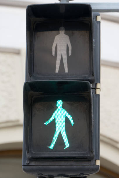 istock standard green figure showing pedestrian traffic light 1440317352
