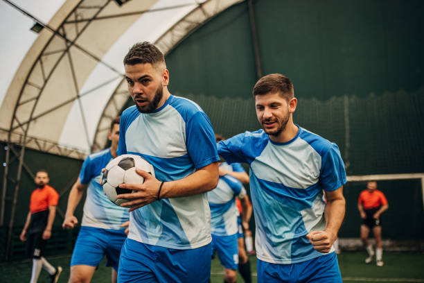 istock Soccer players celebrating a goal 1440322290