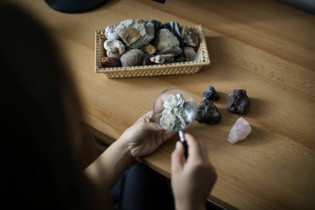 istock Woman examining a mineral 1440323742