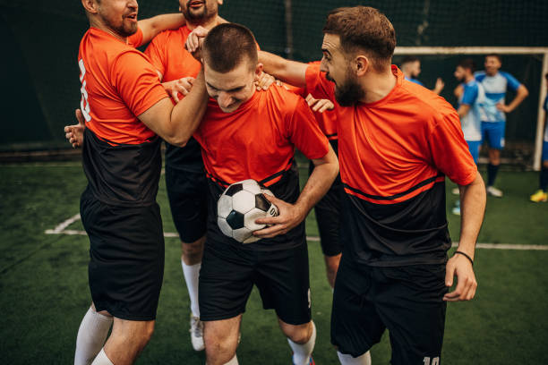 istock Soccer players celebrating a goal 1440324168