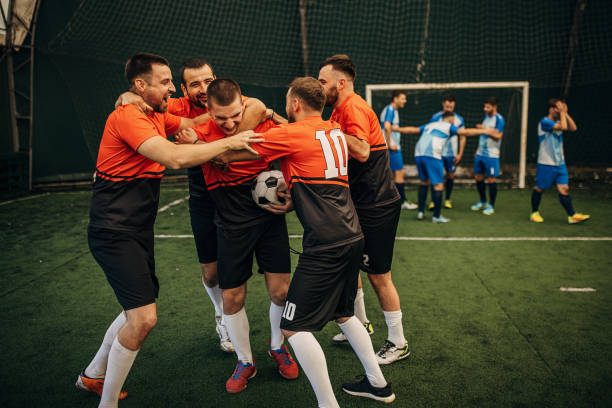 istock Soccer players celebrating a goal 1440324307