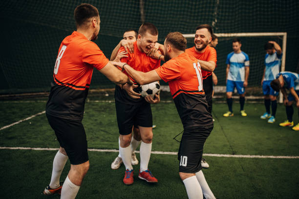 istock Soccer players celebrating a goal 1440324340