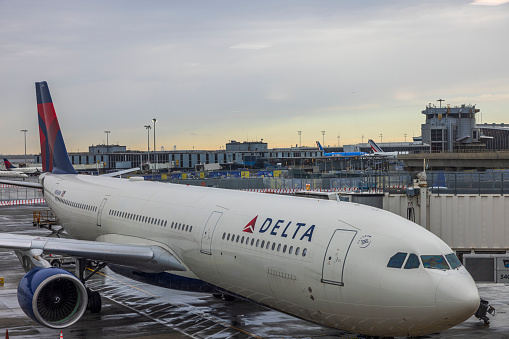 Portland, Oregon, USA - June 30. 2023: A Delta Airlines Boeing 737 climbs out of Portland International Airport on a sunny afternoon.