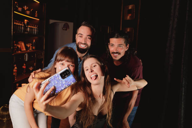 istock girl holding cell phone taking a selfie 1440326155