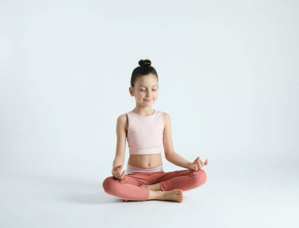 istock Cute Girl Doing Yoga 1440327367