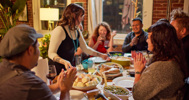 istock People at Friendsgiving Dinner Anticipating Ready to Eat 1440328201