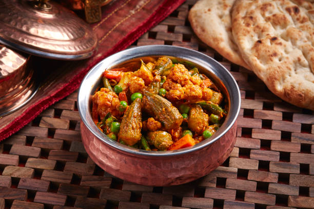 istock Hamour Curry or Hammour Curry with mixed vegetables and bread served in dish isolated on table side view of middle east food 1440332823