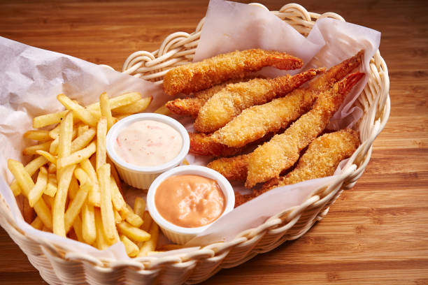 istock Fried Prawns with Chips and mayo dip served in basket isolated on table side view of middle east food 1440333094