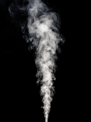 White smoke rises straight up in a straight stream against a black background