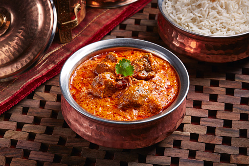 Lamb Rogan Gosht, mutton korma karahi with white rice served in dish isolated on table side view of middle east food