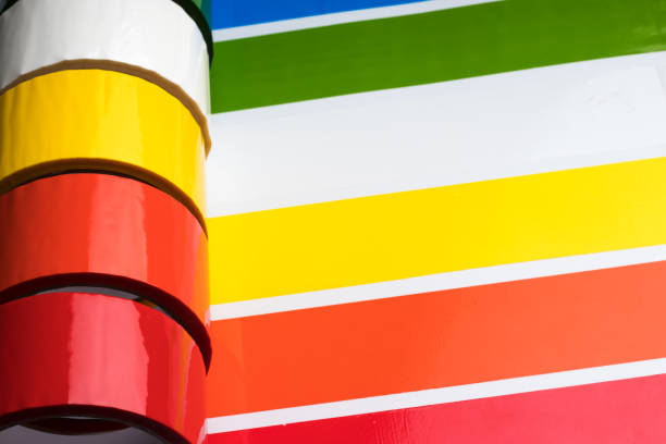 Colored adhesive tape rolls. Stripes of colored tape pasted side by side. Selective focus