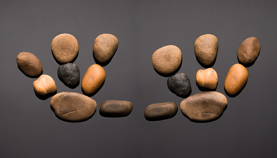 Stony prints of the right and left hand are made up of various pebbles