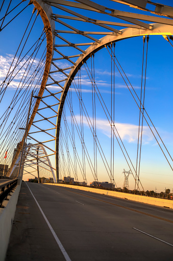 The Broadway Street Bridge spanning over the  Arkansas River, in downtown Little Rock, Arkansas  at sunrise.