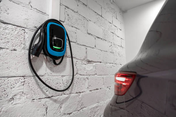 The blue charging station of a modern electric car. The back of the electric crossover. Type 2 connector stock photo