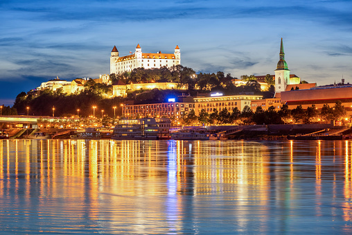 Bratislava Old town, Slovakia, reflecting in Danube river in blue evening light