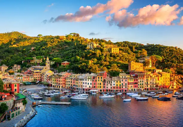 Beautiful sunrise over Portofino, Italy, a picturesque fishing village with colorful houses and a small harbor on italian Riviera near Genoa city, now a popular luxury tourist resort