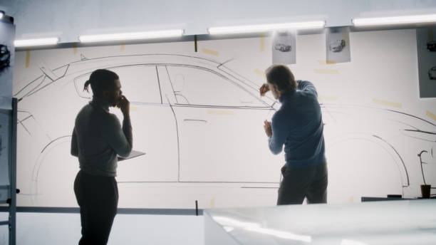 istock Designers working on new electric car sketch 1440345142
