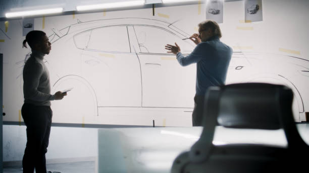 istock Designers working on new electric car sketch 1440345403