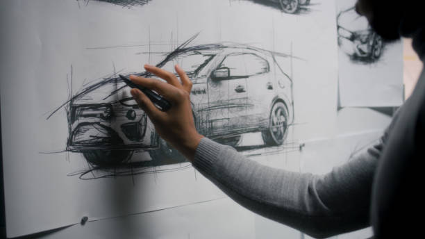 istock Designer drawing new car sketch with marker 1440347168