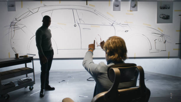 istock Designers discussing electric car design 1440348091