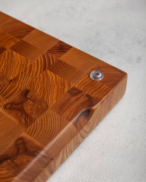 istock Wooden cutting board in the kitchen on a light background 1440349701