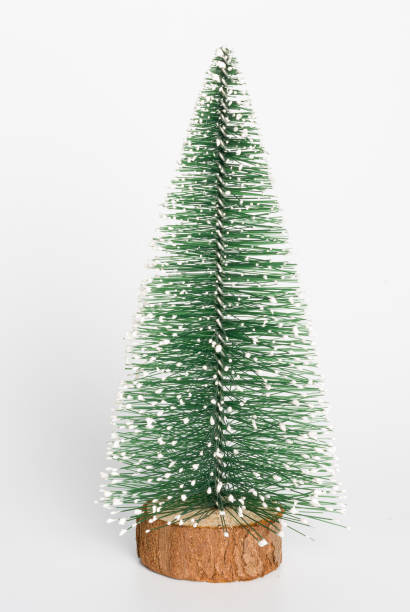 istock decorative Christmas tree, figurine on a white background, close-up 1440350030